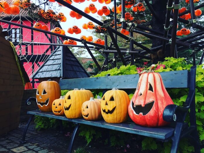 a bench with carved pumpkins sitting on top of it